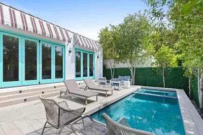 a patio with chairs and a swimming pool at Luxury 4BR Villa with Private Pool in Los Angeles Crescent Heights in Los Angeles