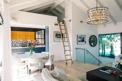 a room with a table and chairs and a ladder at 2BR Luxury Villa in West Hollywood with Private Pool in Los Angeles