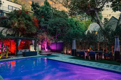 a swimming pool with purple lighting in a backyard at 2BR Luxury Villa in West Hollywood with Private Pool in Los Angeles