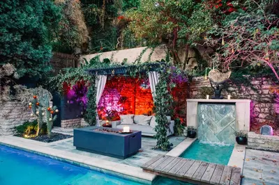 a backyard with a pool and a couch and a table at 2BR Luxury Villa in West Hollywood with Private Pool in Los Angeles