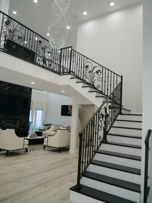 a staircase in a house with a living room at Sleek 7BR Exquisite Estate Resort Pool, Sauna, Spa 6500 SQF in Woodland Hills
