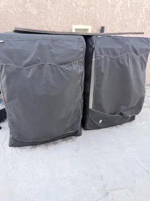 an open black suitcase sitting on the ground at Cozy home in Norwalk