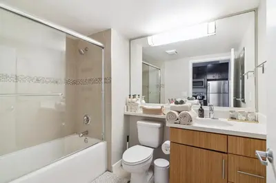 a bathroom with a toilet and a sink and a shower at Sunny Santa Monica Retreat, Walk to Beach in Santa Monica