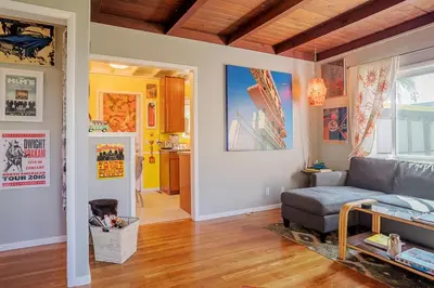 a living room with a couch and a table at Venice Beach House with beautiful private yard in Los Angeles