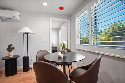 a living room with a table and chairs and a window at A Fresh, Relaxing Oasis Near Monrovia Canyon Park in Duarte
