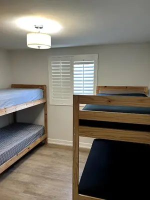 a room with two bunk beds and a window at Normandie Vibes Hostel in Los Angeles