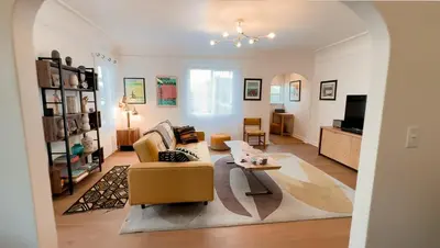 a living room with a couch and a table at Curated Central Location LA in Los Angeles
