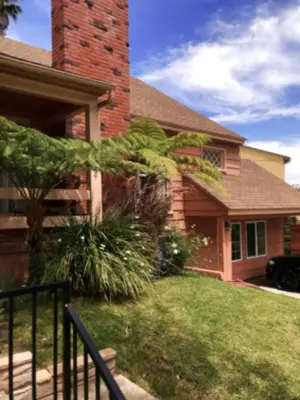 a house with a brick chimney and a yard at Skylight Terrace in Los Angeles