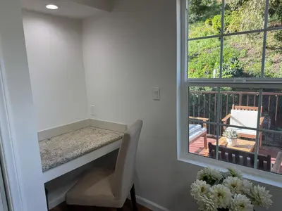 a home office with a desk and a window at Skylight Terrace in Los Angeles