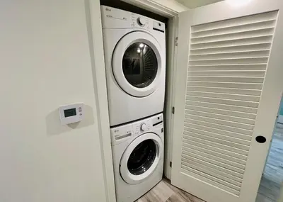 a white washer and dryer in a room at Cozy Century City 2 Br Sleeps 6 with Parking 505 in Los Angeles