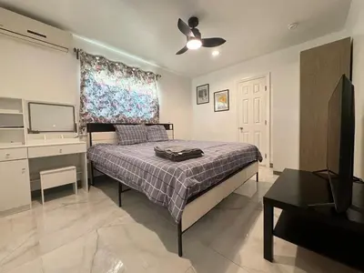 a bedroom with a bed and a ceiling fan at Asian Food Gallery mini back room in San Gabriel
