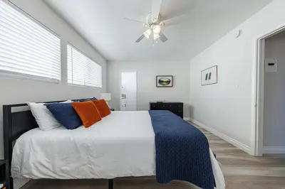 a bedroom with a bed and a ceiling fan at Spacious 2-Bedroom Duplex in Beverly Hills Residential Area in Los Angeles