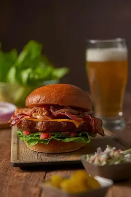 a sandwich on a table with a glass of beer at Hyatt House Cypress / Anaheim in Cypress