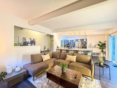 a living room with a couch and a table at Charming 4-Bedroom Home Near Bel Air - BG - WW in Los Angeles