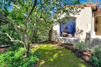 a house with a tree in the yard at Charming 2BR 2BA Los Angeles Home with Character in Sherman Oaks Community Hospital Heliport