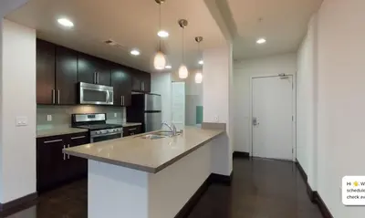 a kitchen with a sink and a counter top at Modern 2BR at the Huxley Prime West Hollywood Location in Los Angeles
