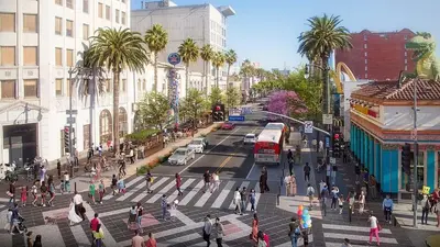 a group of people crossing a street in a city at Studio Haven in the Heart of Hollywood in Los Angeles
