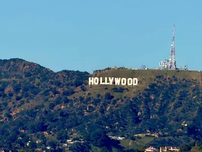 a hollywood sign on top of a mountain at Hollywood Studio with Pool, Parking, Gym & Sign View in Los Angeles