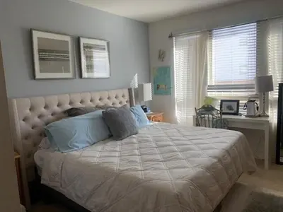 a bedroom with a large bed and a desk at Sweet Beautiful 2 bedrooms home in Los Angeles