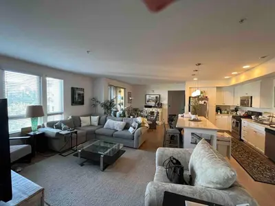 a living room with two couches and a kitchen at Sweet Beautiful 2 bedrooms home in Los Angeles