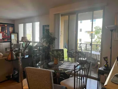 a living room with a dining room table and chairs at Sweet Beautiful 2 bedrooms home in Los Angeles