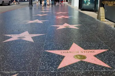 a row of stars on the floor of a sidewalk at Charming Studio in the Heart of Hollywood in Los Angeles