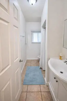 a bathroom with a tub and a sink and a toilet at Charming Studio in the Heart of Hollywood in Los Angeles