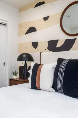 a bedroom with a bed with a cow wall at Modern 3BR Retreat with Rooftop Deck Sleeps 8 in Los Angeles
