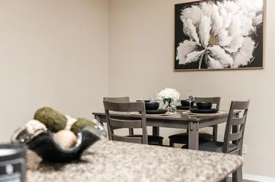 a dining room with a table and chairs at Stylish Glendale Retreat by Americana & Galleria in Glendale