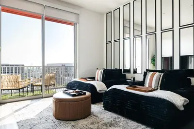 a living room with a couch and a table at Penthouse Muse, West Hollywood, Los Angeles in Los Angeles