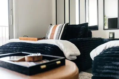 a living room with a couch and a table at Penthouse Muse, West Hollywood, Los Angeles in Los Angeles