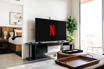 a living room with a tv with the letter n on it at Penthouse Muse, West Hollywood, Los Angeles in Los Angeles