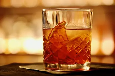 a glass of iced tea on a table at The Crescent Hotel Beverly Hills in Los Angeles