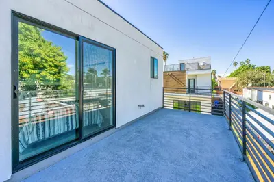 a large balcony with a large glass window at 2BR 2BA Villa in Melrose with Free Parking in Los Angeles