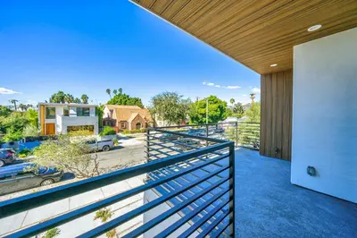 a balcony with a railing and a view of a parking lot at 7 BR double house with parking and a backyard in LA in Los Angeles