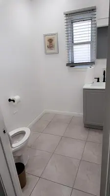 a bathroom with a toilet and a sink at Modern2BR Home SoFi LAX Parking Fast WiFi in Los Angeles
