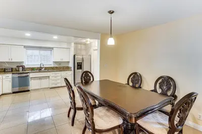 a kitchen with a dining room table and chairs at 5 Mi to Anaheim Convention Center Retreat with Yard in Anaheim