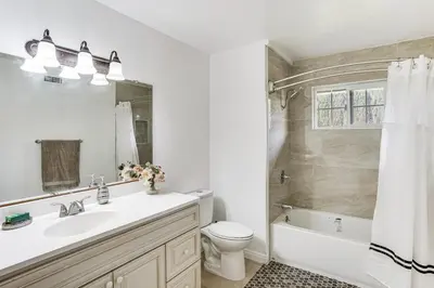 a bathroom with a sink and a toilet and a shower at 5 Mi to Anaheim Convention Center Retreat with Yard in Anaheim