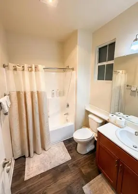 a bathroom with a toilet and a shower and a sink at Marina Del Rey Heavenly Stay in Los Angeles