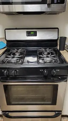 a stove top oven sitting in a kitchen at Shared but isolated room in a shared soace in Los Angeles