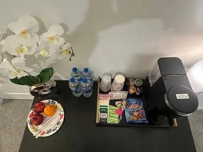 a black table with food and drinks on top of it at Ali's home in Fontana
