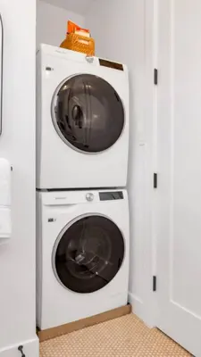 a washing machine and a dryer with a microwave at NEW Venice Rose Ave Retreat with Sunset Deck in Los Angeles
