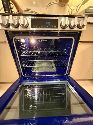 an oven with its door open in a kitchen at SkyLoft in Woodland Hills