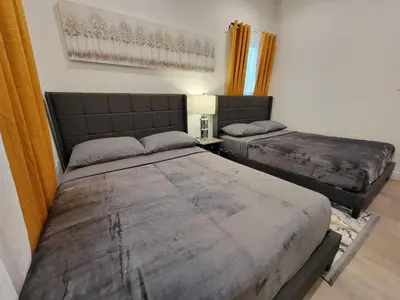 a bedroom with two beds in a room at Spacious 2-Bedroom, One and a Half Bath Home in Pico-Robertson Near Beverly Hills and Cedars-Sinai in Los Angeles