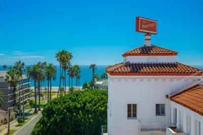 a white building with a sign on top of it at The Sovereign in Los Angeles