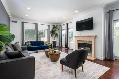 a living room with a couch and a fireplace at Stylish Home Prime Location with Fireplace & Patio in Los Angeles