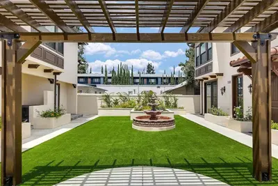 a courtyard with a fountain in the middle of a yard at Luxurious Pasadena Home w Parking & Near Old Town in Pasadena