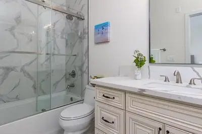 a bathroom with a shower and a toilet and a sink at Luxurious Pasadena Home w Parking & Near Old Town in Pasadena