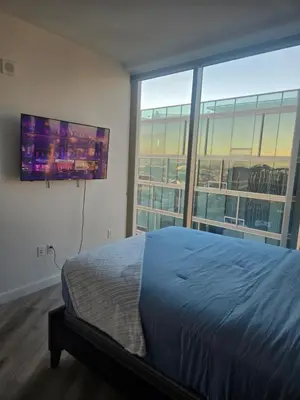 a bedroom with a bed and a large window at 2 Bedroom with City Views in Los Angeles