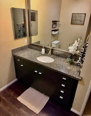 a bathroom with a sink and a mirror at The Luxe Marina HideAway in Los Angeles